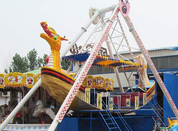 16 seat pirate ship amusement ride with dragon head design installed in outdoor park