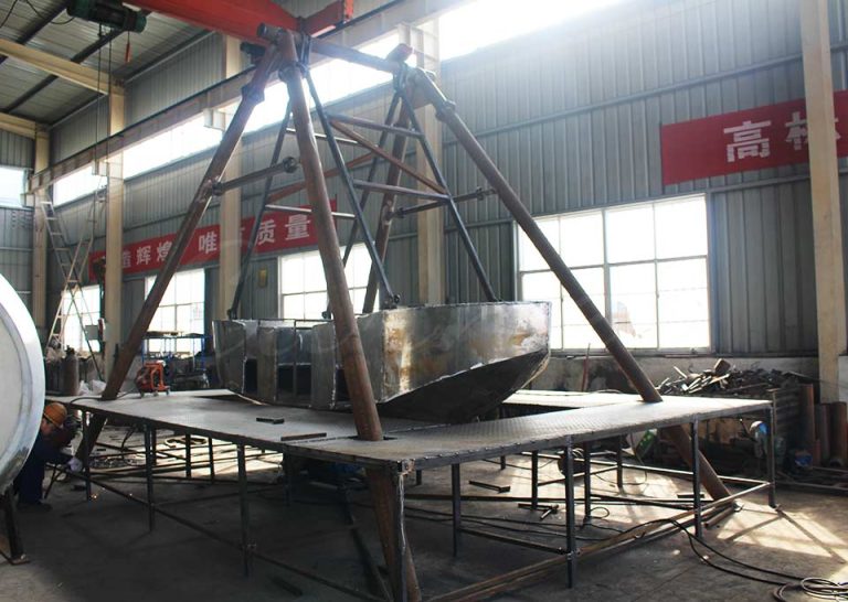 Workshop production of 16 seat pirate ship ride steel structure under assembly