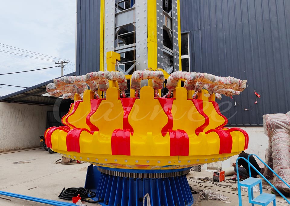 Passenger seats and safety restraints of 30m rotating drop tower ride during assembly