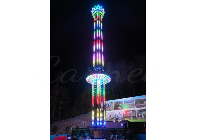 30m rotating drop tower ride with colorful LED lighting at night