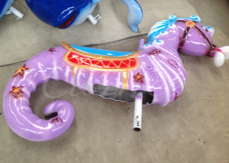 Purple seahorse seat with starfish and shell patterns, matching the ocean theme perfectly for kids' rides.