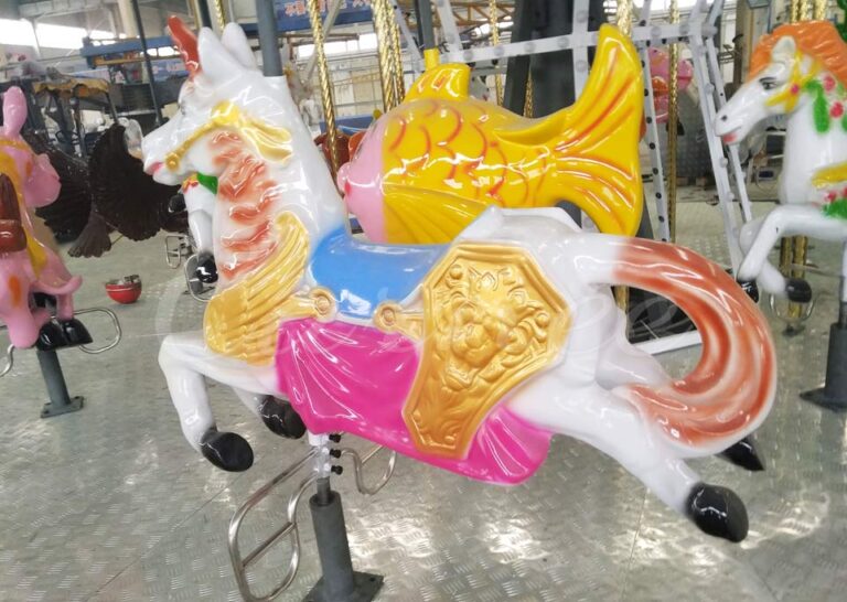 Detailed close-up of a colorful carousel horse figure on a 16-seat kiddie ride with decorative saddle and harness