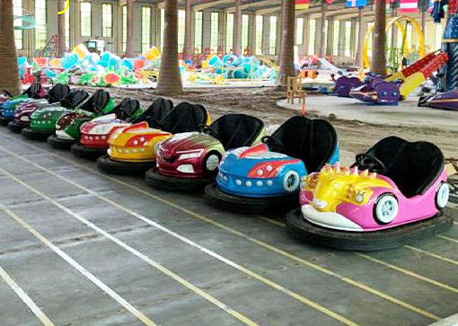 Colorful ground grid bumper cars lineup for amusement park indoor use