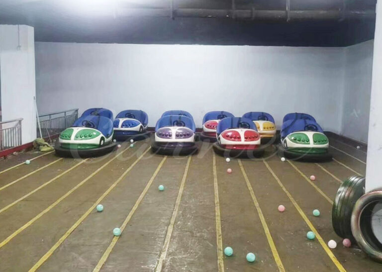 Ground grid bumper cars indoor venue with colorful balls scattered on floor