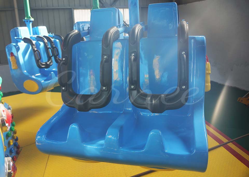 Close-up view of the seating area of the Airborne Shot ride showing comfortable and secure seat design with safety bars.