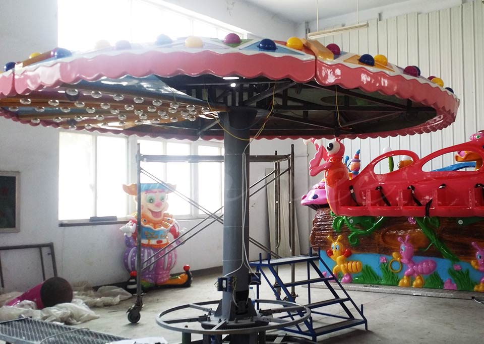 Clown Flying Chair Ride main structure and central support column in the workshop