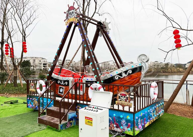 Front view of Mini Pirate Ship Ride with safety features and vibrant decorations.