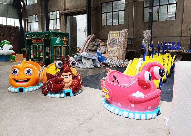 Variety of cartoon ocean animal roller coaster cabins including fish, crab, pufferfish, and octopus shapes