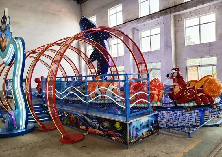 Indoor ocean animal roller coaster track with multiple cartoon cabins, suitable for family entertainment centers