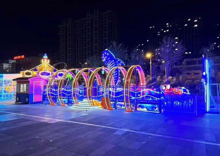 Night view of the Undersea Adventure roller coaster entrance gate, illuminated with attractive LED lights