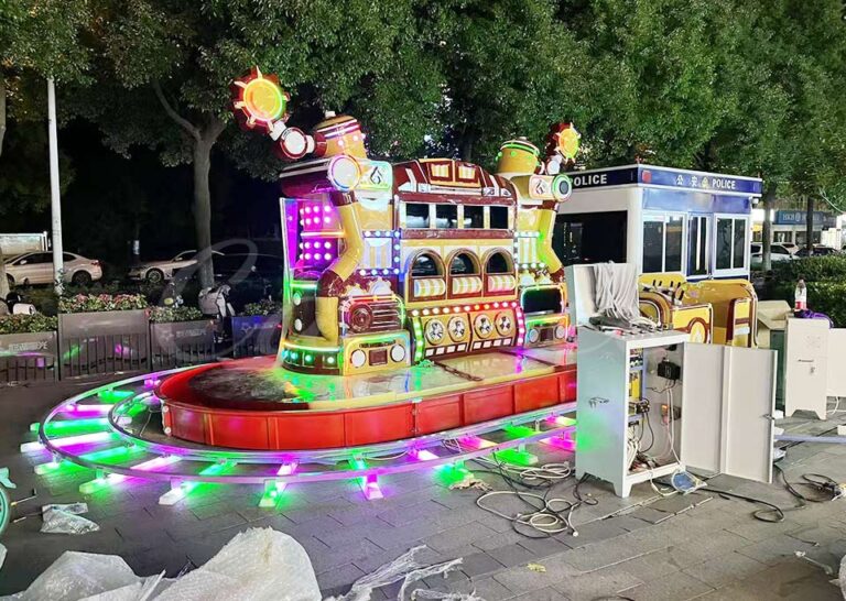 Full view of the Urban Firefighting Heroes Track Train Ride with vibrant lights and steam effects.