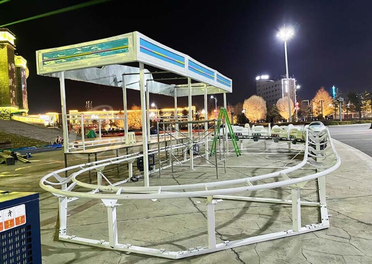 Installation process of the high-speed train roller coaster in the theme park.