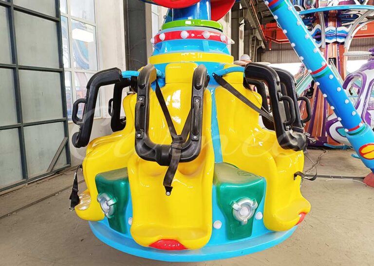 Close-up of the seating area for Mini Pendulum Ride, designed for children with safety harnesses, perfect for small thrill ride experiences at amusement parks