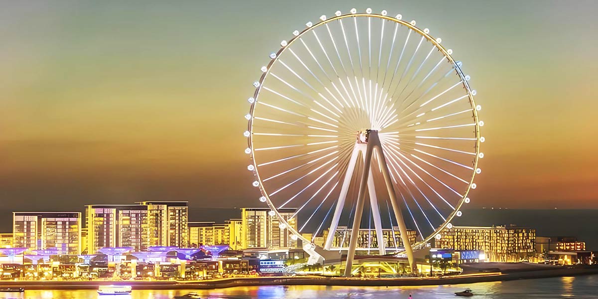 Ain Dubai Ferris Wheel, the largest in the world, beautifully lit at night.
