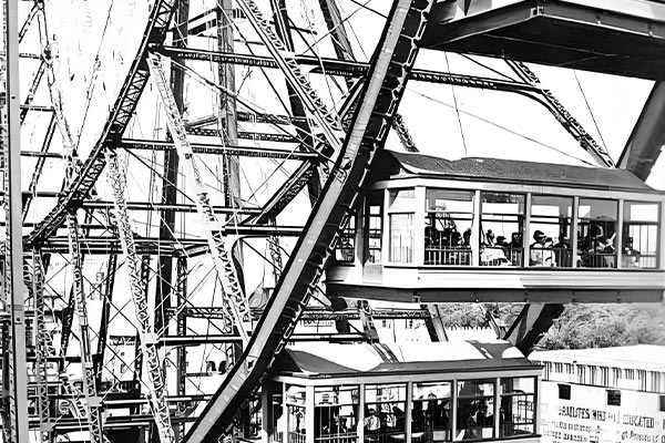 Close-up view of the first Ferris Wheel with passengers in cabins, Chicago World's Fair.