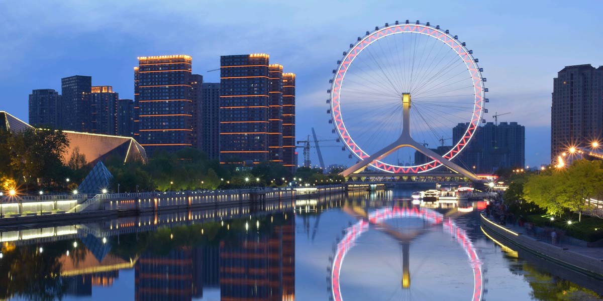 The Tianjin Eye Ferris Wheel in China, showcasing a stunning skyline view.