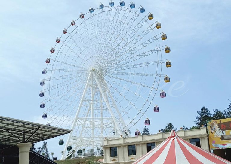 View of the 66m Ferris wheel from the entrance, with the stairway and surroundings showcasing its grandeur and beauty.