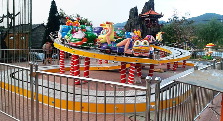 Branding and advertising integration for backyard roller coasters, displaying company logos and unique designs to enhance visibility.