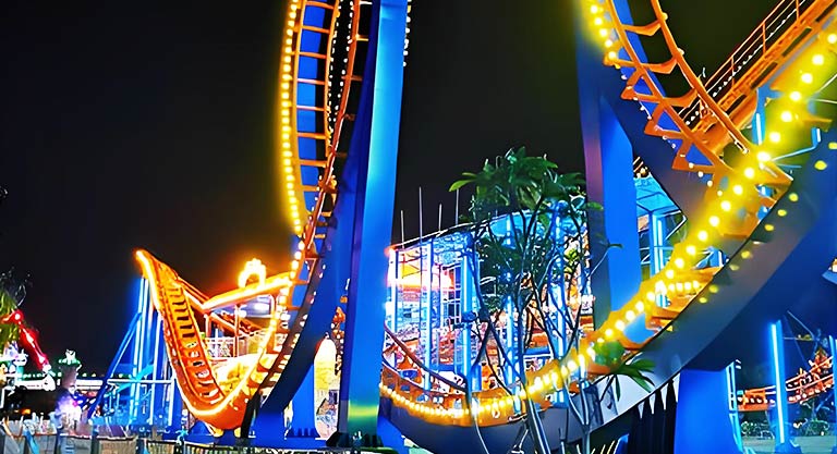 Custom lighting design for backyard roller coasters, showcasing vibrant LED lights for an enhanced visual experience during night rides.