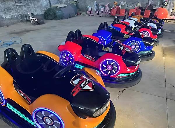 Battery-powered bumper cars lined up for adults, featuring stylish designs and bright LED wheels.