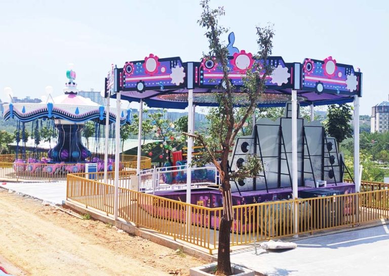 Electric Music Disco Tagada Ride newly installed in outdoor amusement park with vibrant LED canopy and mechanical bouncing disc.