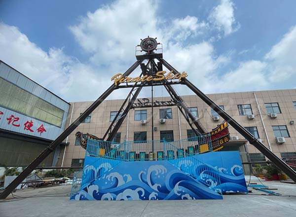 Pirate ship amusement ride installed outdoors at Carnee Rides factory