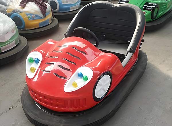 Red classic bumper car with durable fiberglass body, designed for amusement parks.