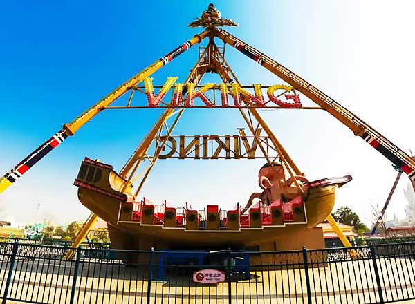 Large Viking ship ride installed in an amusement park with bright decorative design