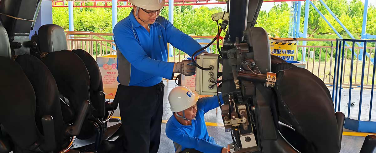 Amusement park ride maintenance: technicians performing safety and mechanical checks to ensure the proper functioning of the ride.
