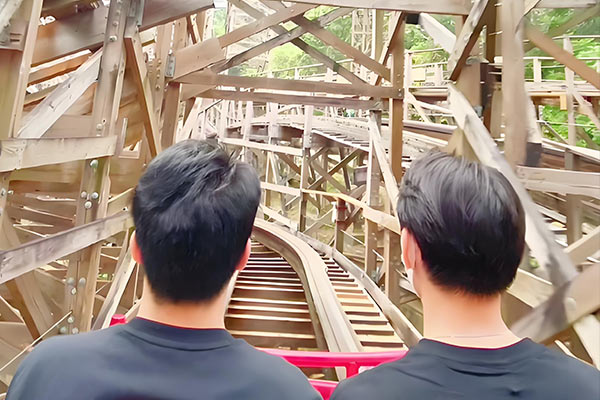 Front seat view of a wooden roller coaster track showing structure details and the importance of wood roller coaster maintenance.