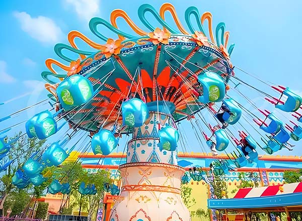 Colorful chair swing ride in a family amusement park, offering a fun and thrilling experience with vibrant seating, ideal for children and families to enjoy together.