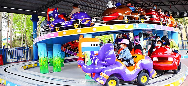 Double-deck backyard roller coaster for kids with colorful cars on two levels