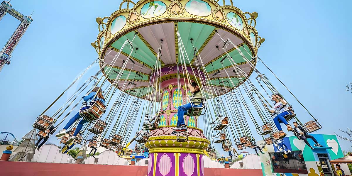 Family-friendly amusement ride wave swinger ride with adults and children enjoying the experience, symbolizing the lasting popularity of swing rides.