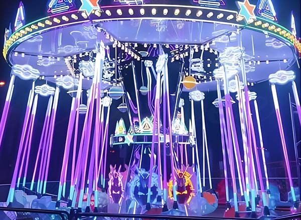 Neon lights enhance the excitement of a Flying Swing Ride, creating a mesmerizing experience for visitors.