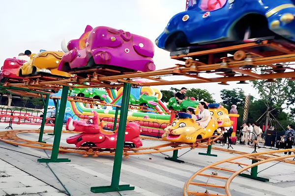 Cartoon animal backyard roller coaster for kids with colorful cars shaped like animals