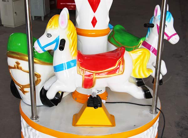 Colorful fiberglass horse on 3-seat mini carousel, durable and bright design for children’s amusement rides.