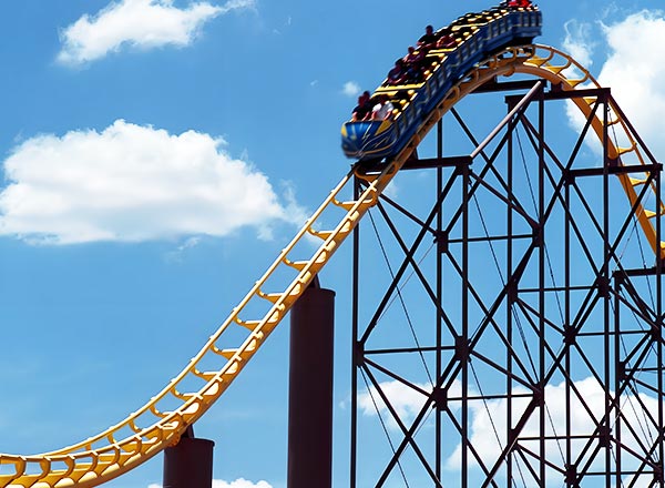 Roller coaster ride climbing steep track during routine maintenance and safety checks.