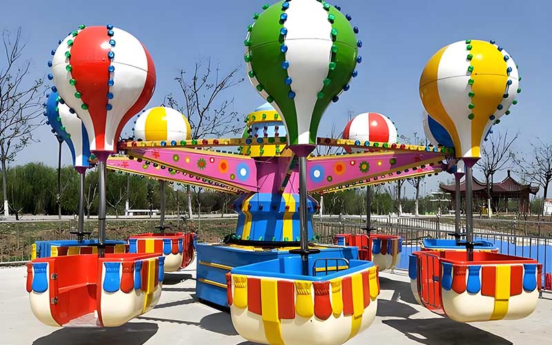Outdoor Samba Balloon Ride with bright hot-air-balloon cabins installed in a kids amusement park