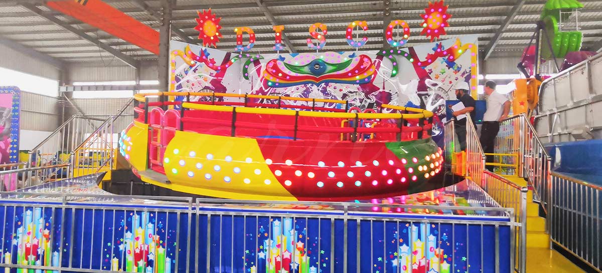 Wahana disko Tagada dengan musik, lampu, dan kursi berputar oleh Produsen Wahana Hiburan Carnee