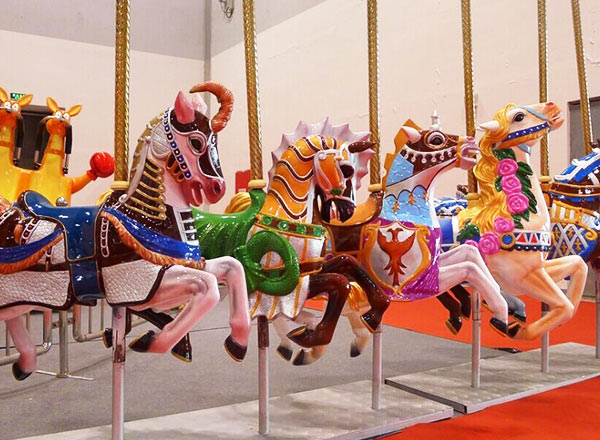 Colorful carousel horses on a spinning ride at an amusement park, showcasing the magic of merry-go-rounds