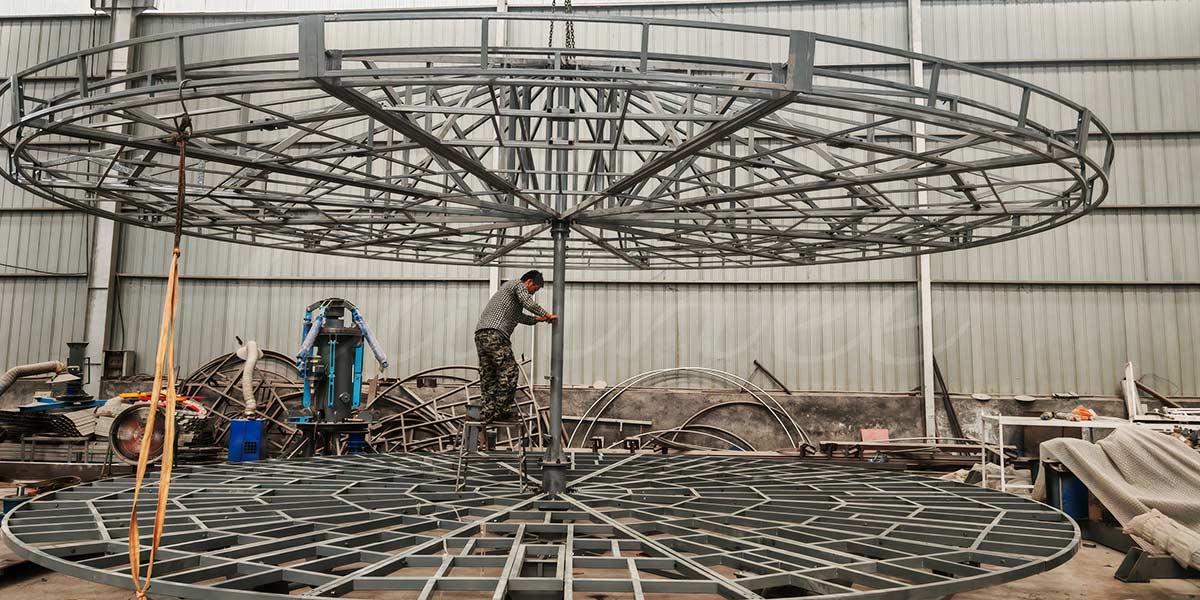 Carousel manufacturer working on production assembly for a new merry-go-round ride.
