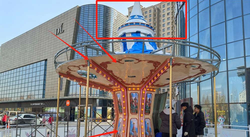 Installing and securing the carousel platform with wooden panels to ensure rider comfort and durability