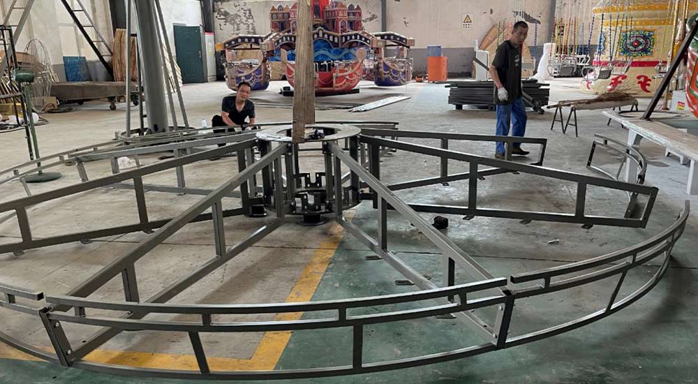 Installing the umbrella frame of a 16-seater carousel ride – assembling 8 key structural parts for stability
