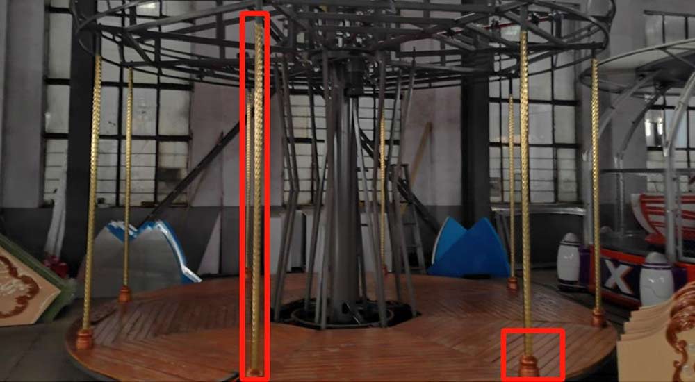 Installing the top decorative iron frame on the carousel’s umbrella structure to enhance stability and aesthetics