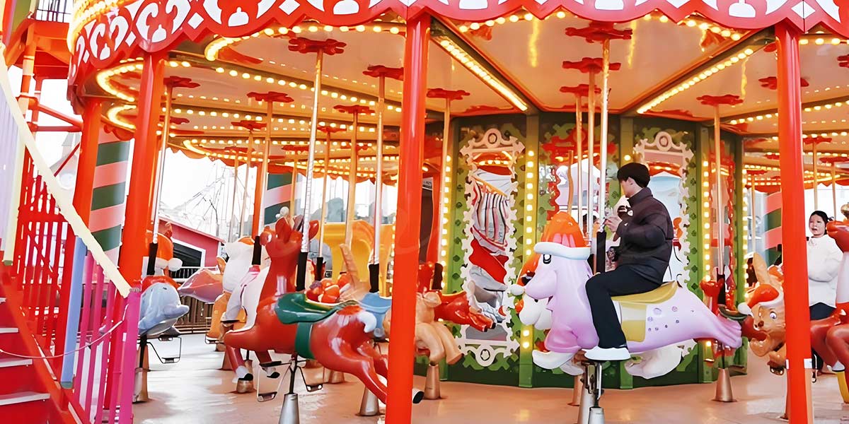 Christmas-themed double-decker carousel with festive decorations and colorful lighting, offering a joyful holiday experience for visitors.