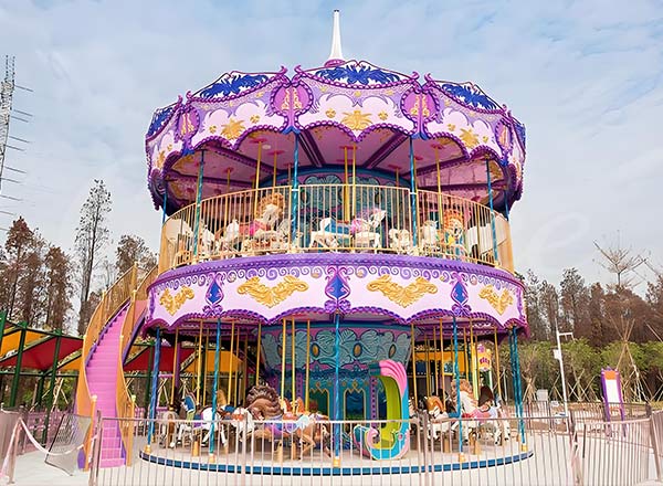 Double-decker carousel in an amusement park with vibrant decorations, showcasing both upper and lower seating levels for a unique experience.