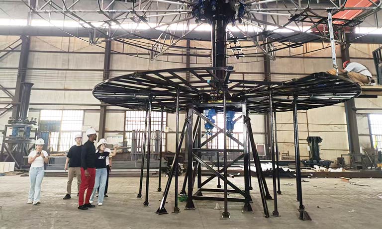 Carnee Rides after-sales service team providing on-site technical support and inspection for a double-decker merry go round carousel installation.