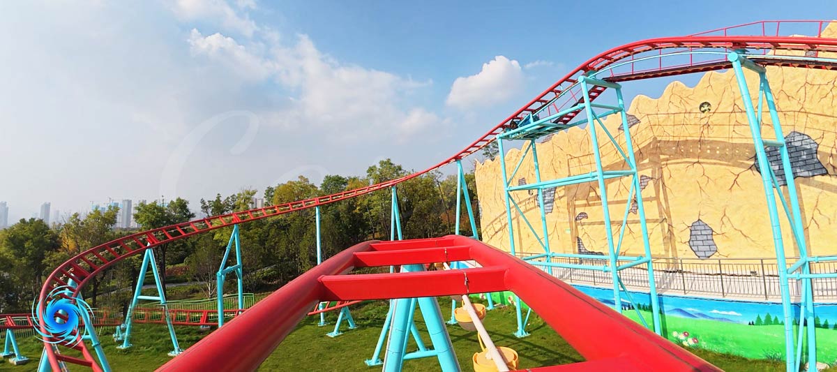 Red family roller coaster track designed and manufactured by Carnee Amusement Rides Supplier in amusement park.
