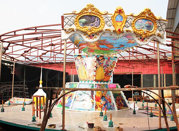 Theme Park Carousel assembly in progress with detailed artwork and vibrant design for a fun and engaging ride