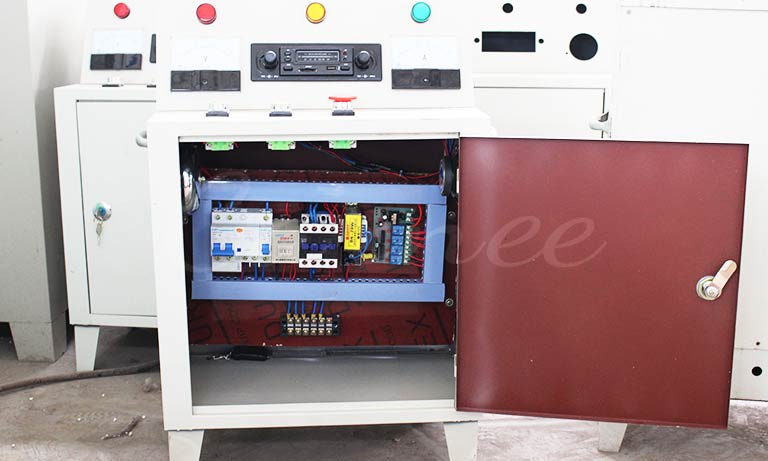 Electrical control cabinet of Carnee Rides two level merry-go-round carousel, showing CE-compliant wiring, overload protection, and safety control systems.